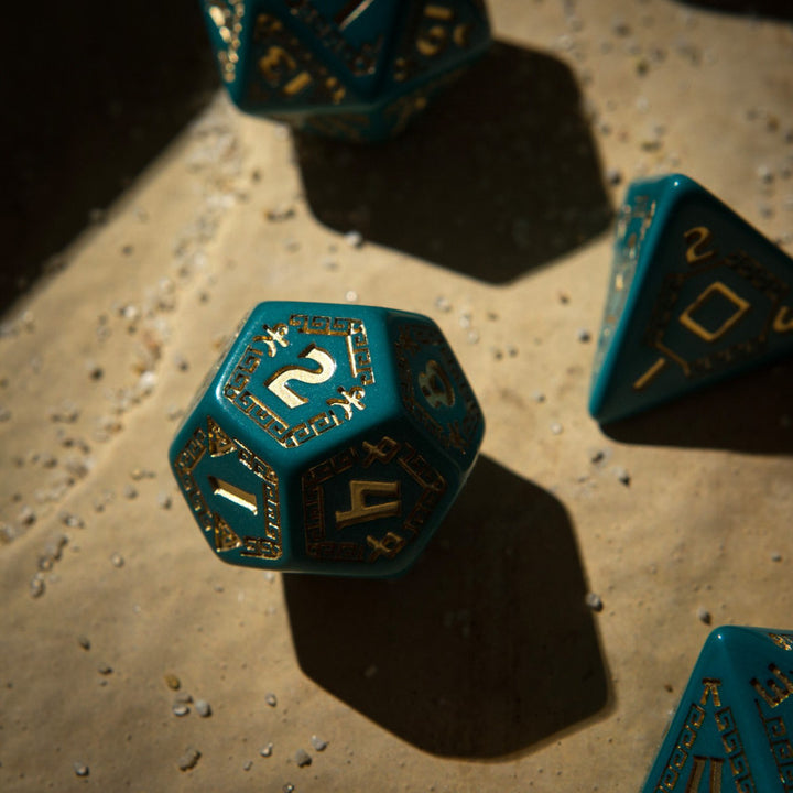 RuneQuest Turquoise & gold Dice Set (7) (Q-Workshop) (SRQU97)